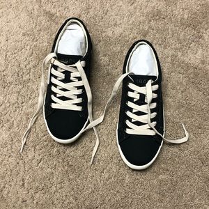 Brand new unworn Taos sneakers in black (6.5)